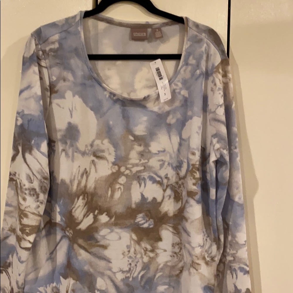 Beautiful floral spring/fall colors, nice shirt to dress up or down.